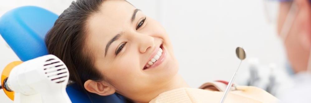 Woman smiling during her Baton Rouge dental exam