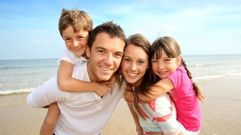 A family at the beach | dentist baton rouge