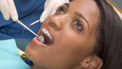 A woman getting a dental exam | dentist Prairieville LA