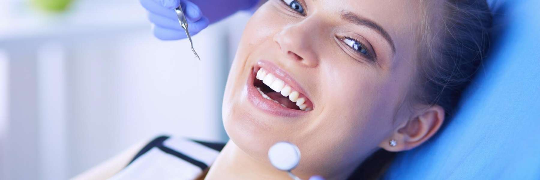 A woman receiving emergency dental care in Prairieville