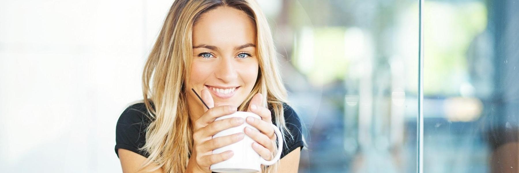 Woman drinking hot chocolate | dentist baton rouge la